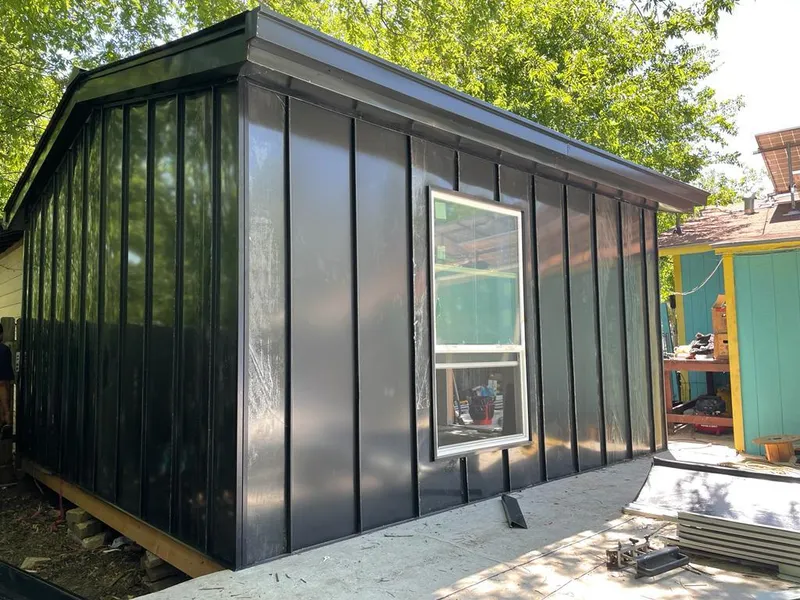 Black standing seam metal wall panels for Roof Inspection in College Station