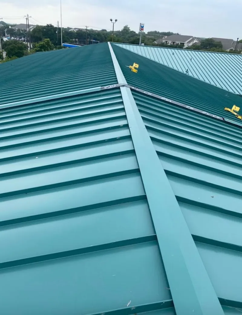 Green commercial metal roof ridge and valley for Metal Roof Repair in College Station